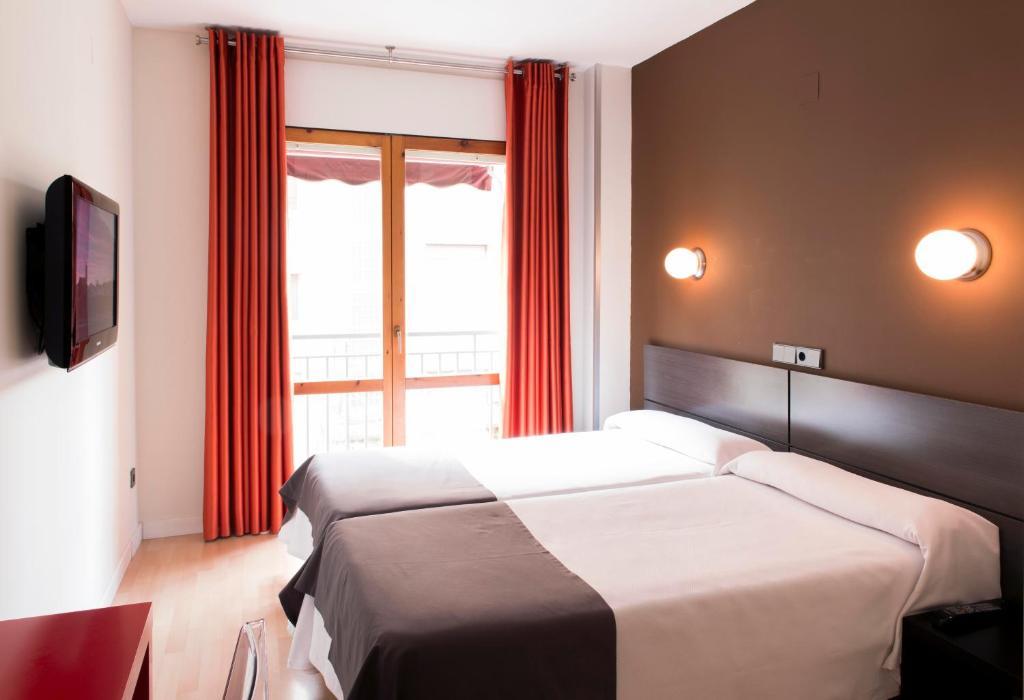 Hospedium Hostal Un Punto Chic Huesca Zimmer foto